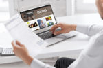 Business blog image with a laptop and papers